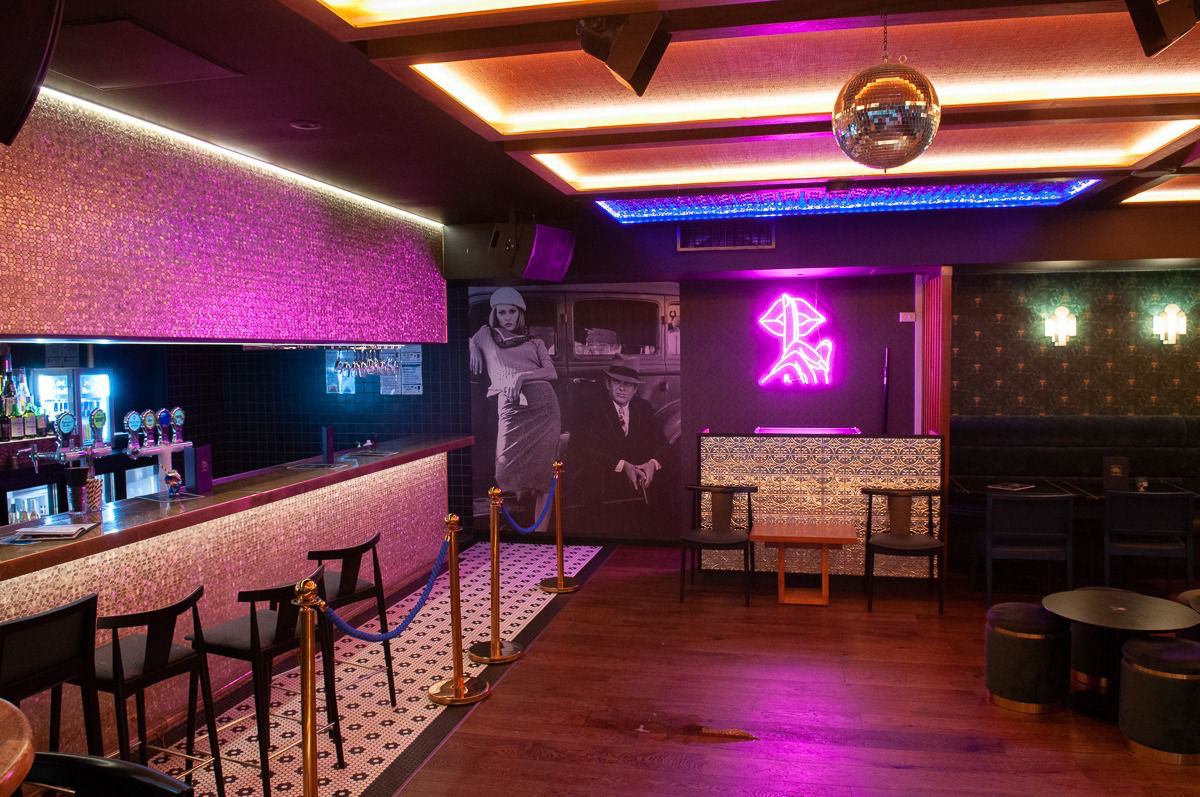 Follies Bar basement bar with neon lighting